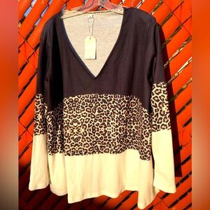 NWT women’s long sleeve V-neck top in tri-color. 1/2 off sale if buying 2 items